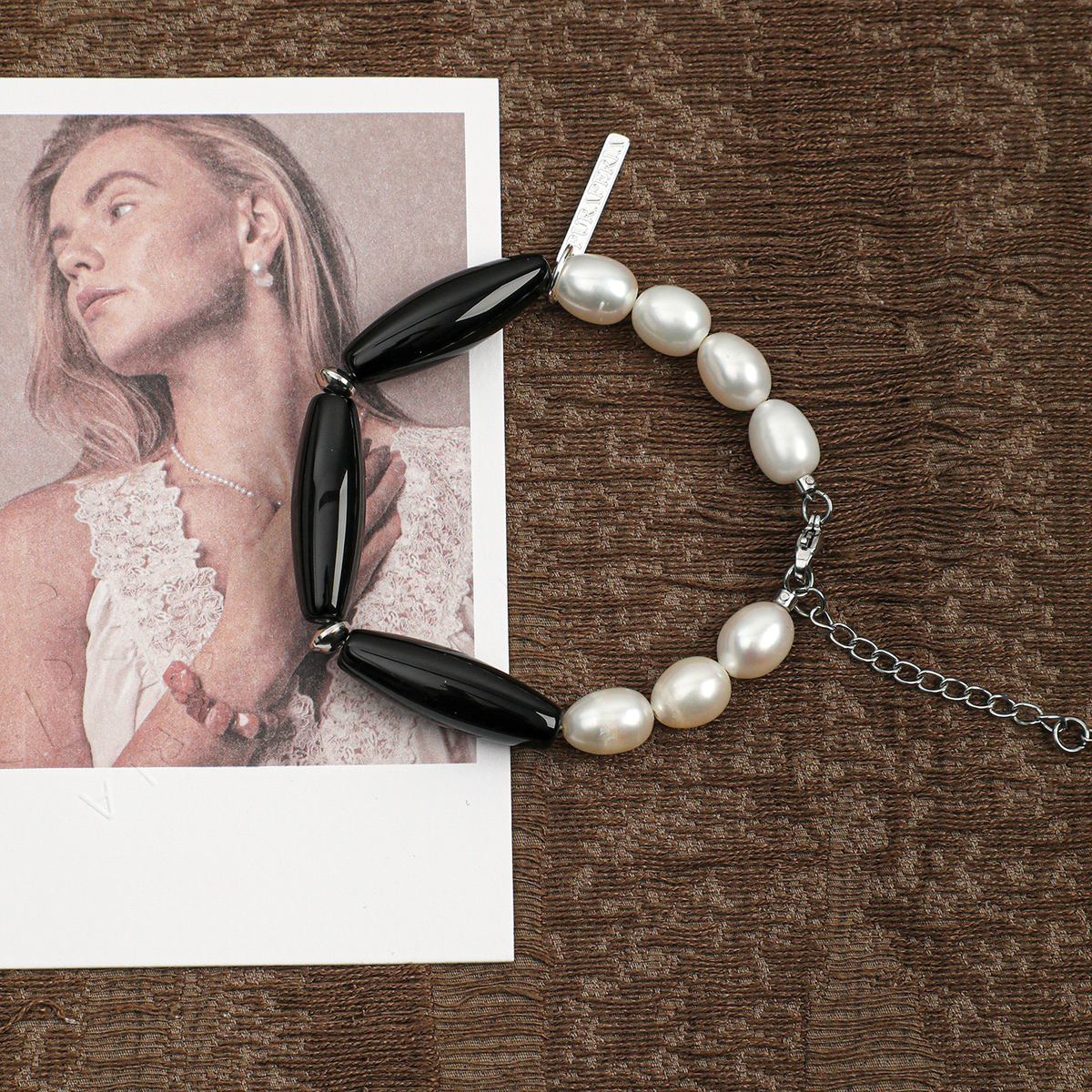 Freshwater pearl and black agate adjustable bracelet in a lifestyle setting