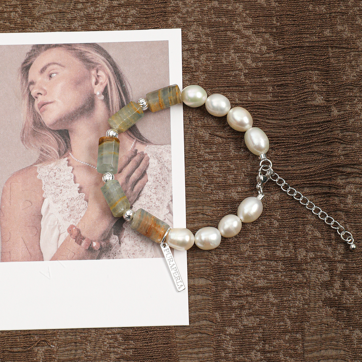 Freshwater pearl and Blue Lishi stone bracelet worn on wrist