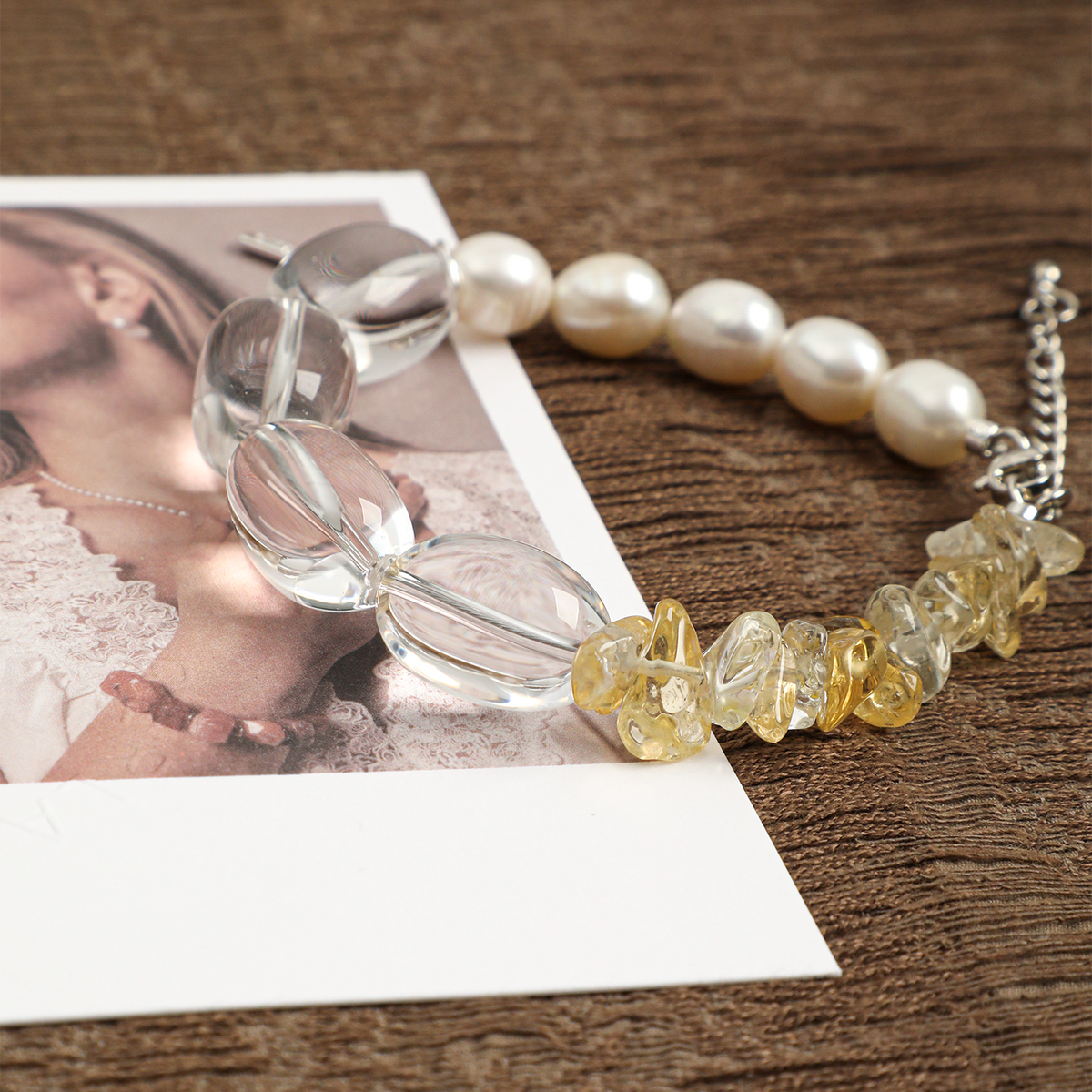 Angled view of clear quartz ovals and golden citrine chips