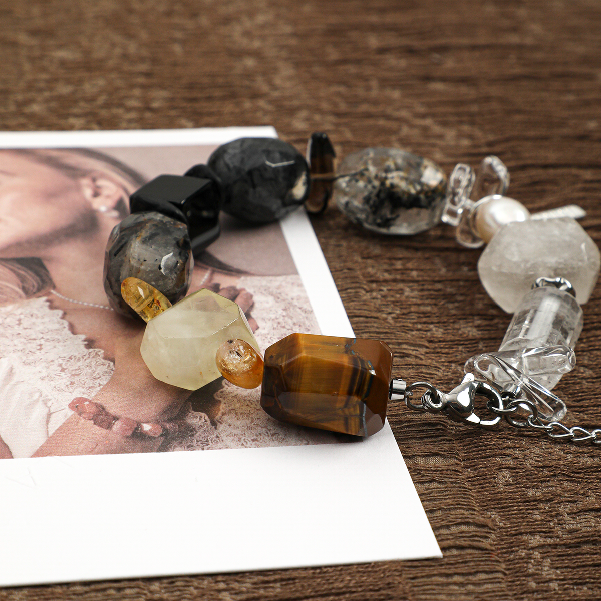 Mixed gemstone bracelet close-up showing warm and dark natural stones
