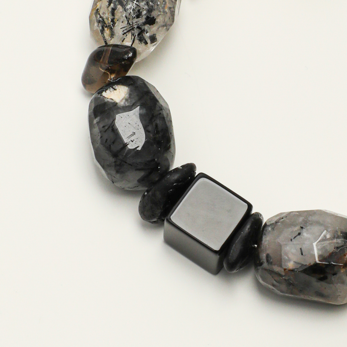 Black agate, black tourmaline, smoky quartz, and black rutilated quartz detail