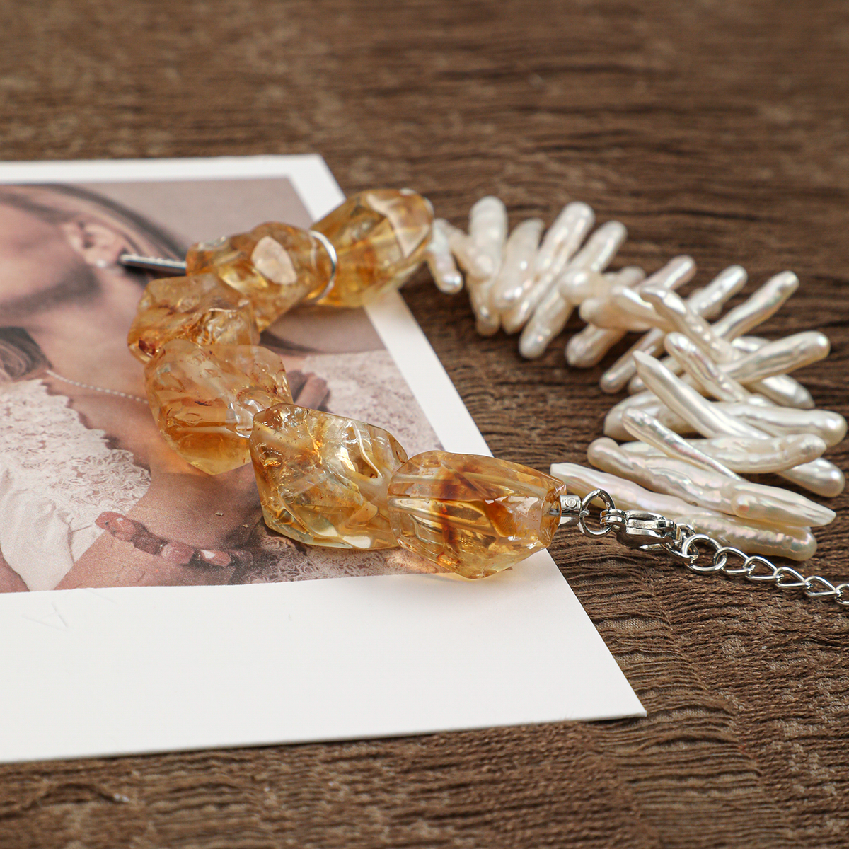 Side view of faceted citrine and freshwater pearl bracelet